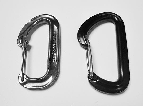 side-by-side comparison of two carabiners