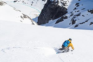 Photo of Antte Lauhamaa skiing in the mountains.