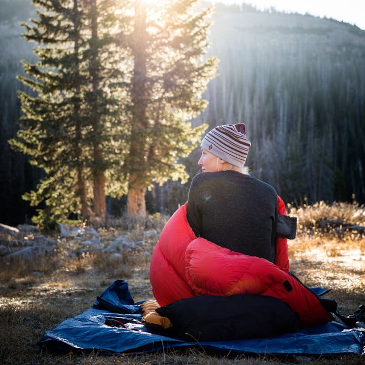 Photography by Andy Earl of woman wrapped in blanket while outside | Women's Base Layer Pants