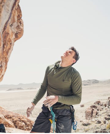 Climber wearing the Black Diamond Alpenglow Hoody.
