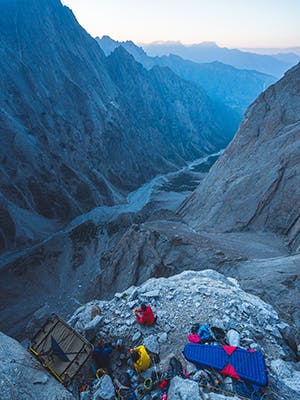 team taking a rest on the climb