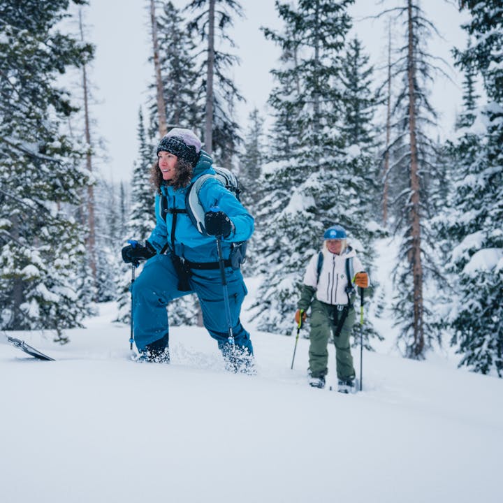 Two backcountry skiers wearing Black Diamond Recon outerwear.