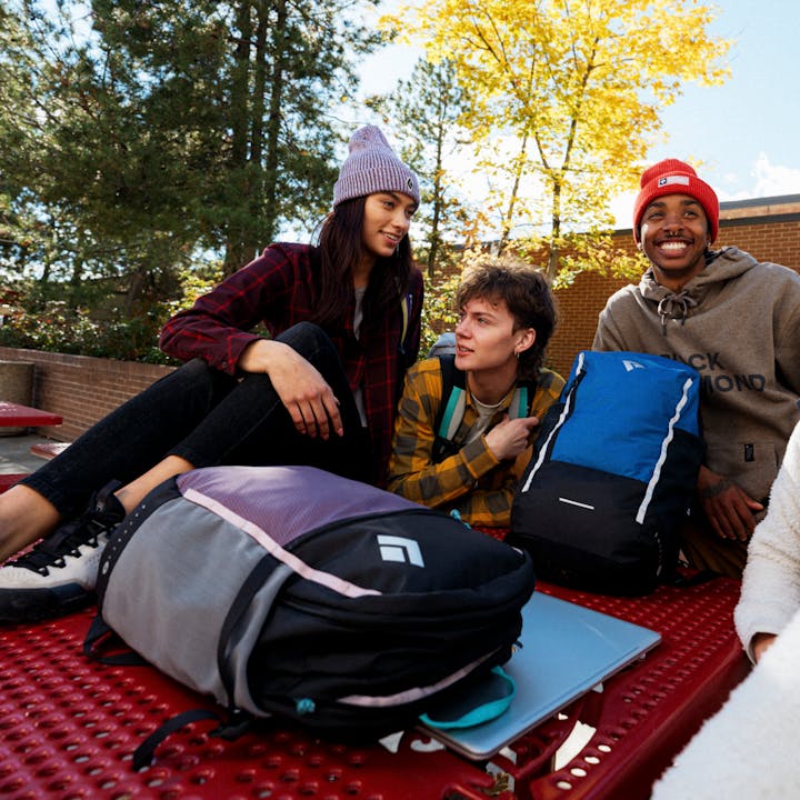 Four students wait for a train with their Black Diamond Campus Series Backpacks.