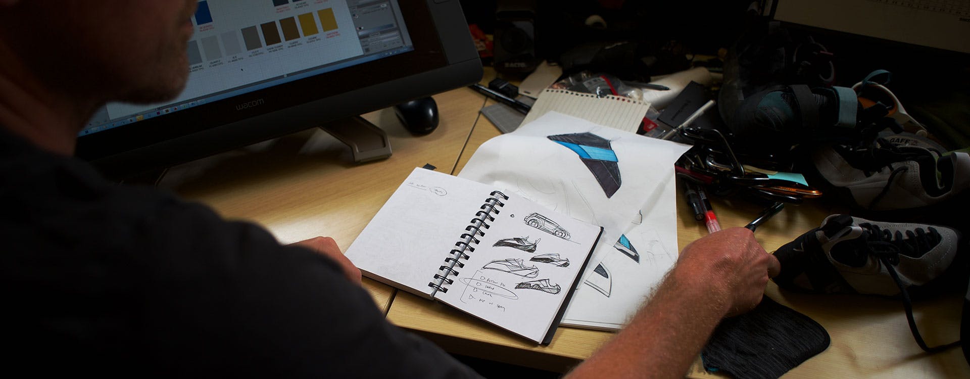 designer working with sketches and prototypes of BD climbing shoes