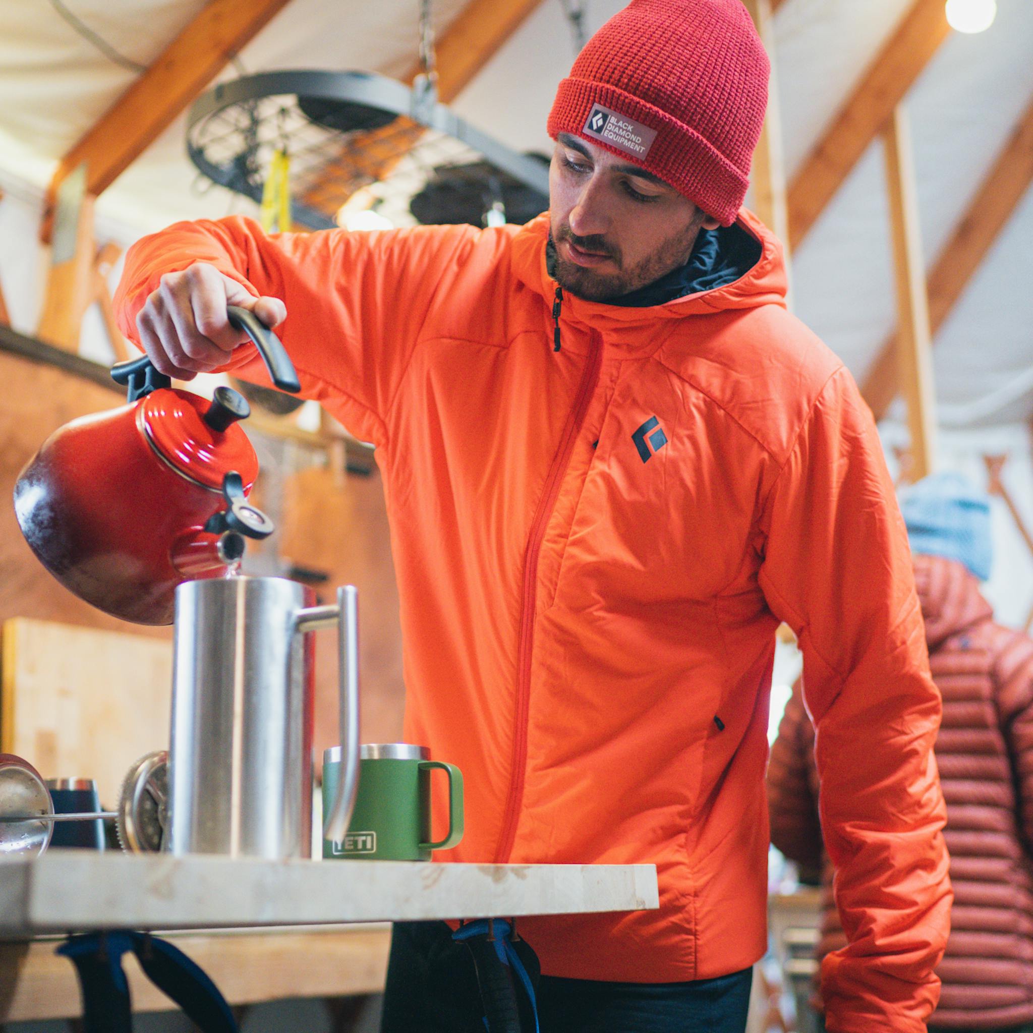 A backcountry skier making coffee before a dawn patrol.
