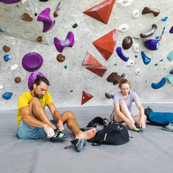 A couple of climbers  wearing Black Diamond performance apparel to get the most out of their session. 