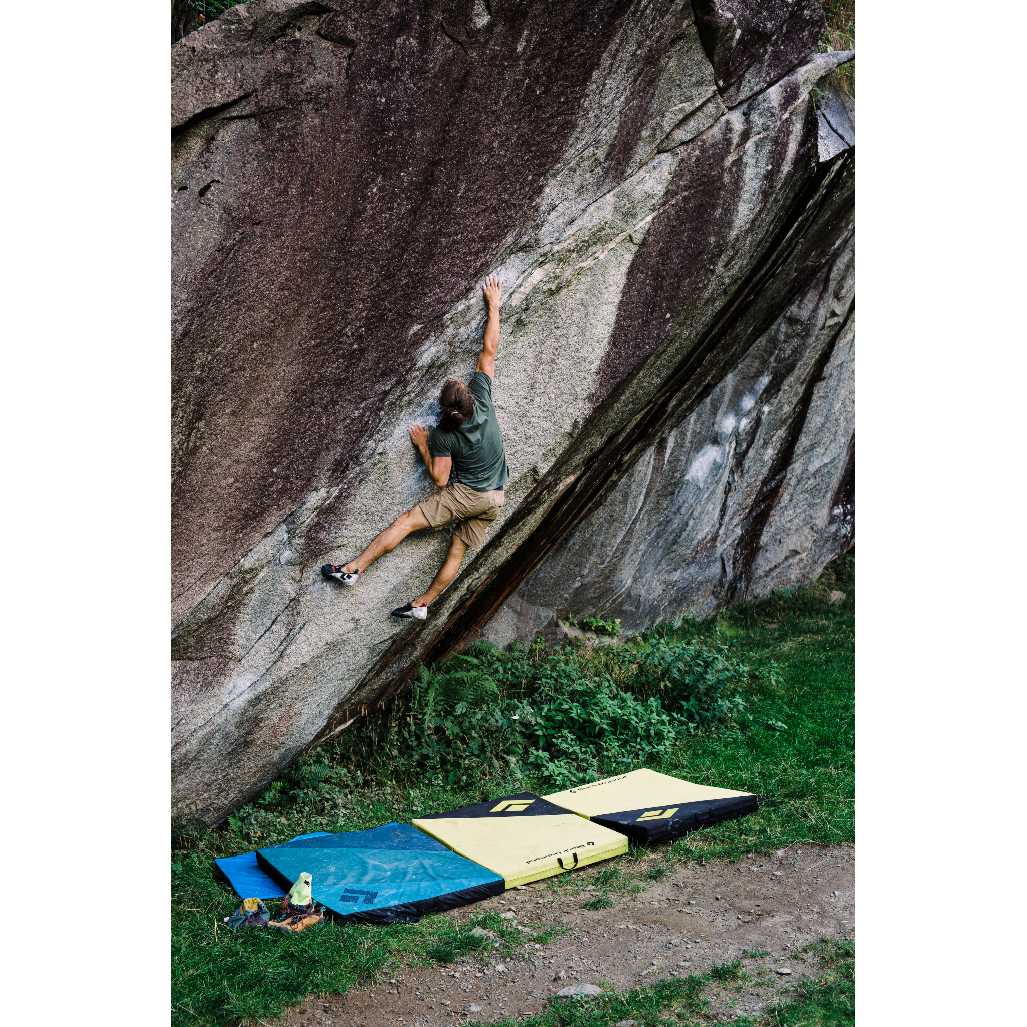 A climber sticks a deadpoint move on a boulder problem. 