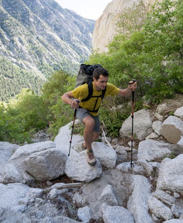 Black Diamond employee approaching the crag with the Alpine Carbon Cork Trekking poles. 