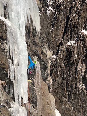 Photograph by Kolin Powick of Doug Chabot ice climbing in Montana