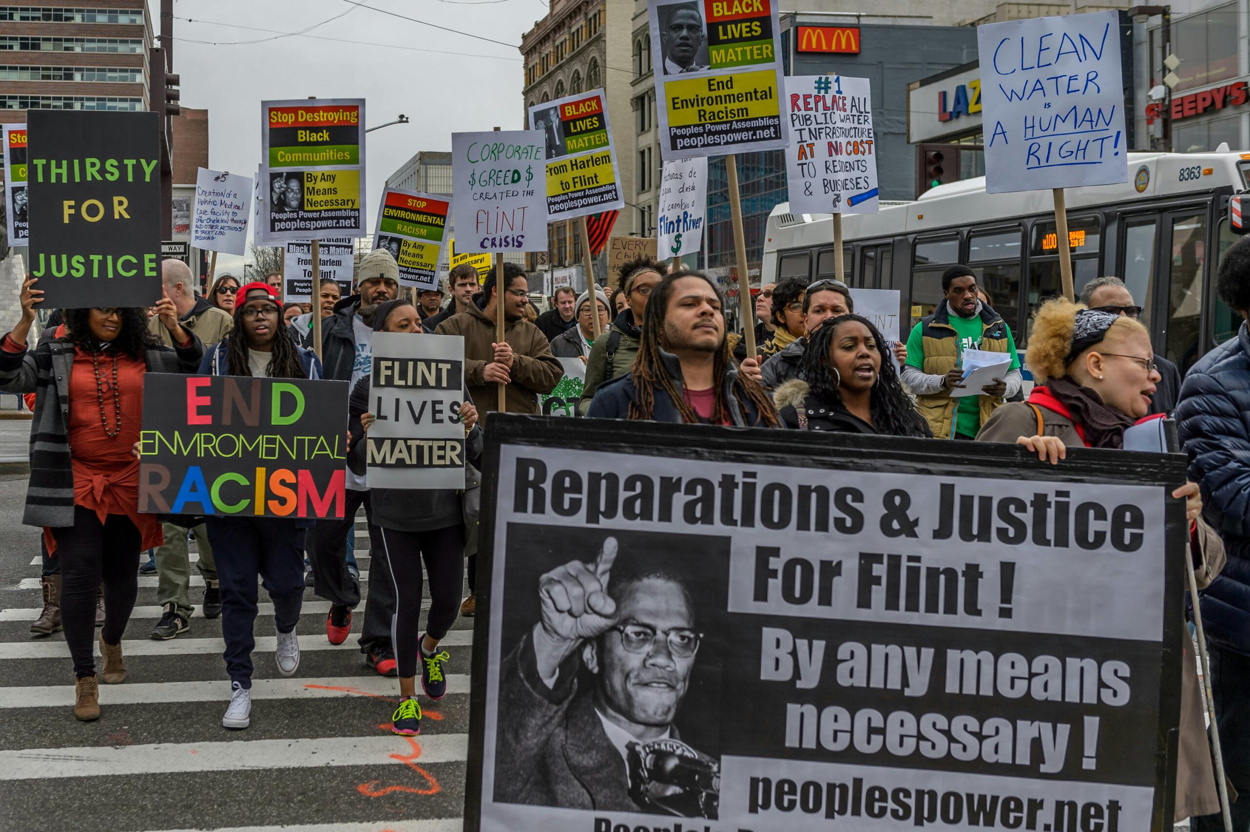 A coalition of NYC Black Lives Matter activists and environmental justice groups march on the 51st anniversary of the assassination of Malcolm X in 2016 to demand justice for the people of Flint, Michigan. Credit: Erik McGregor/LightRocket via Getty Images