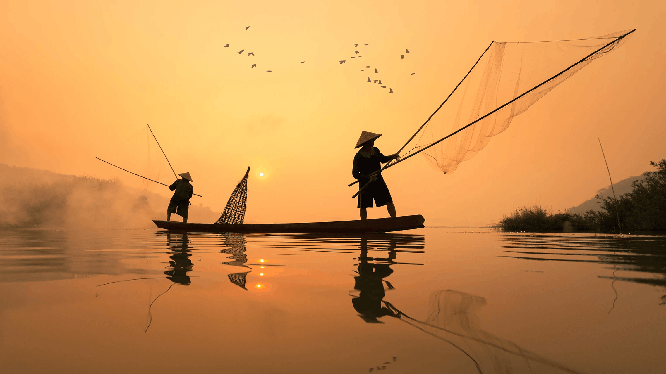 Pescatori in barca in Thailandia