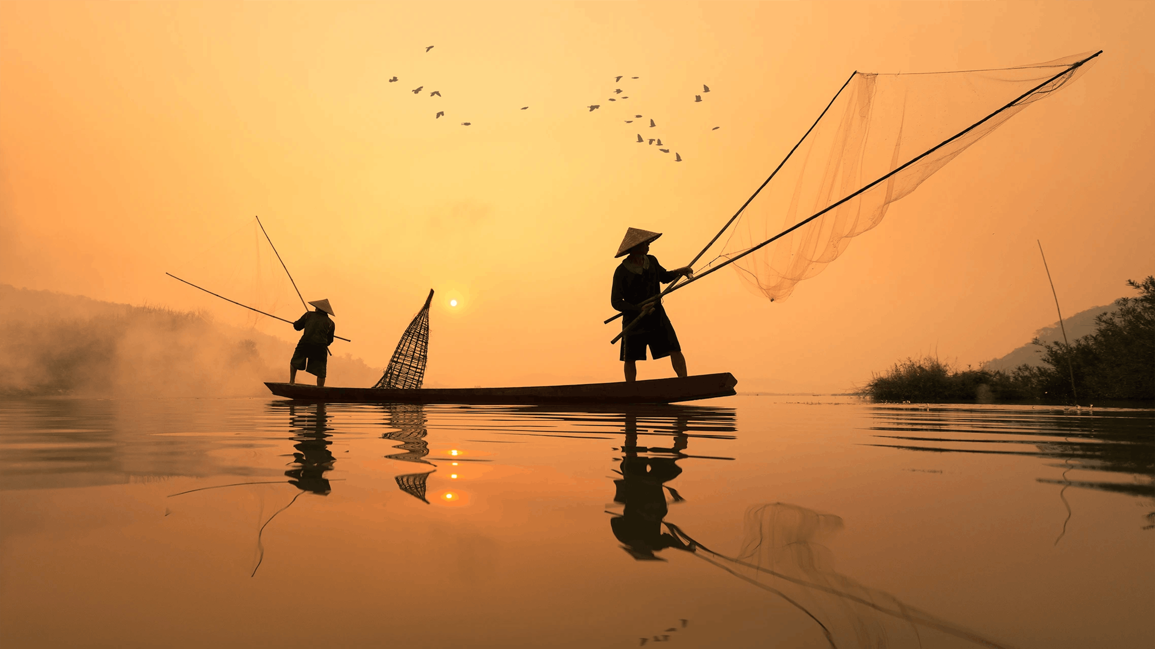 Pescatori in barca in Thailandia