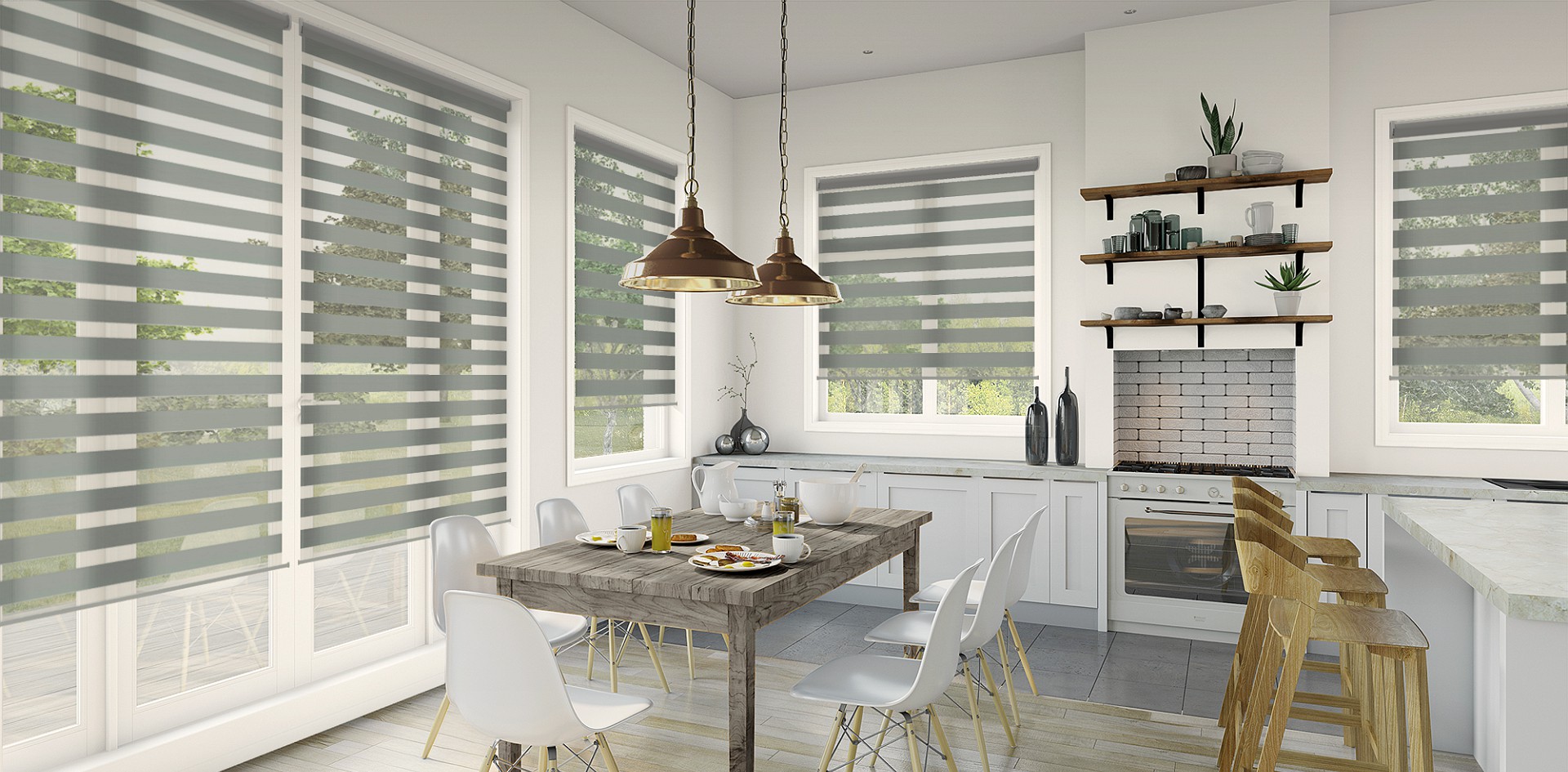 Double roller blinds filtering daylight across tall windows in a kitchen