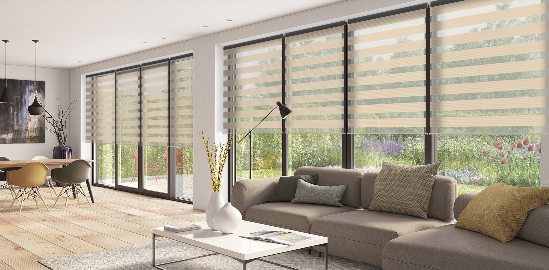 Double roller blinds filtering daylight across tall windows in a living room 
