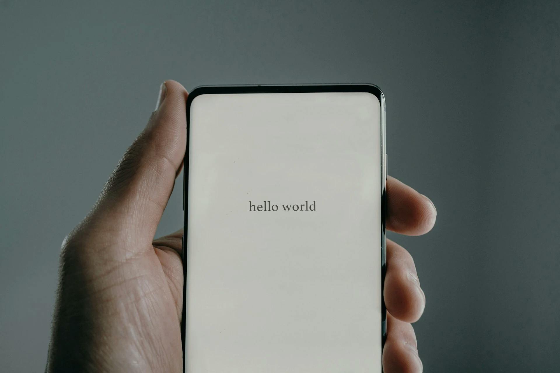 Smartphone with "Hello World" in hand