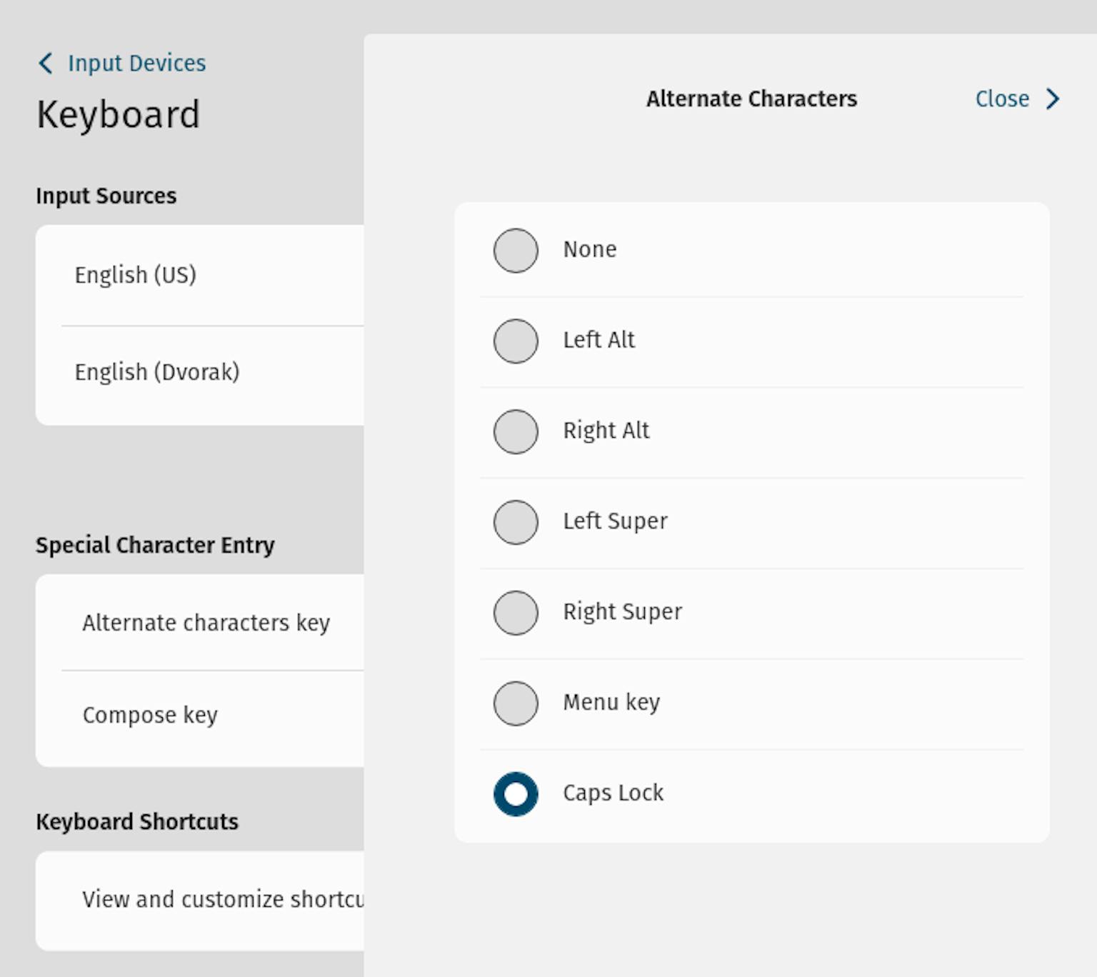 Context drawers now display selections for the alternate characters and compose keys. Here, Caps Lock is selected as the alternate character key.