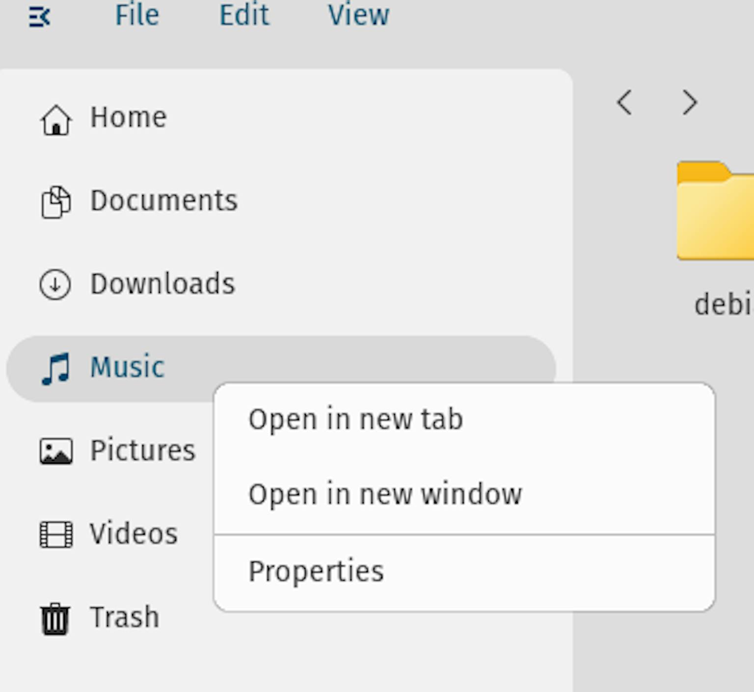 The  "Music" entry in COSMIC Files' navigation sidebar has been right-clicked. The resulting context menu shows options to open Music files in a new tab, open in a new window, or view Properties.