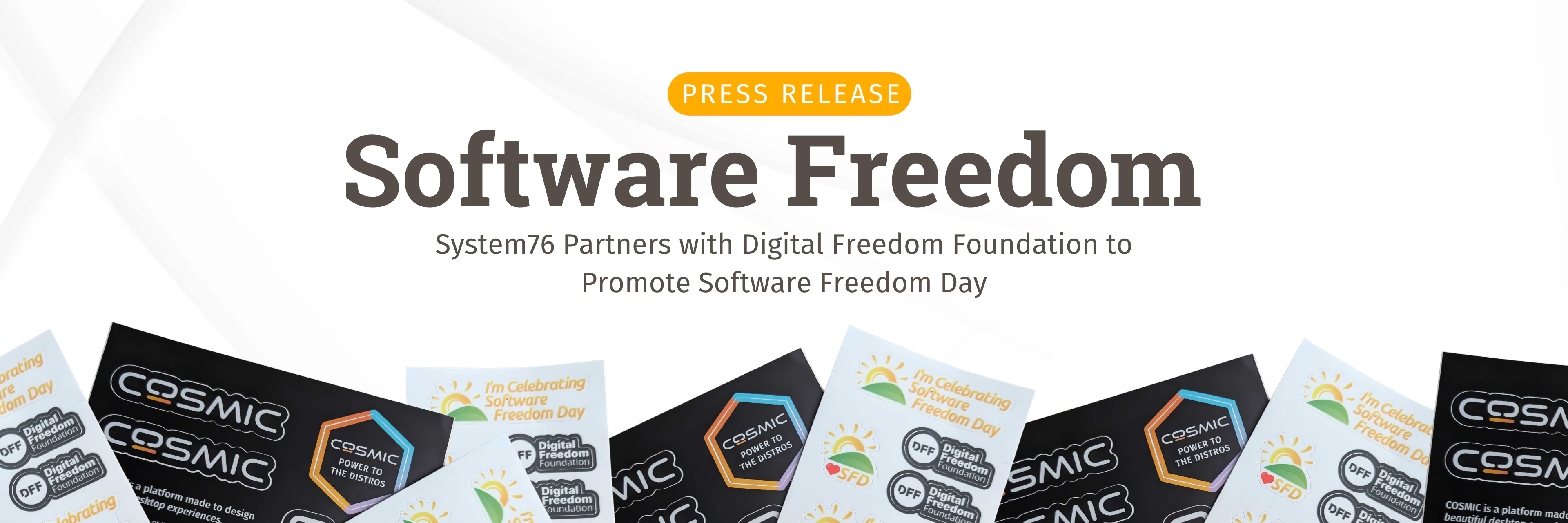 Text that reads Software Freedom and System76 Partners with Digital Freedom Foundation to Promote Software Freedom Day with stickers on the bottom border