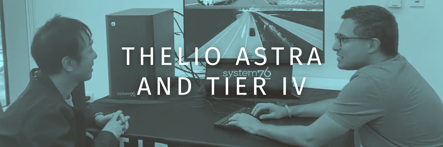 Two Tier IV experts discuss their latest simulation at a Thelio Astra workstation setup.