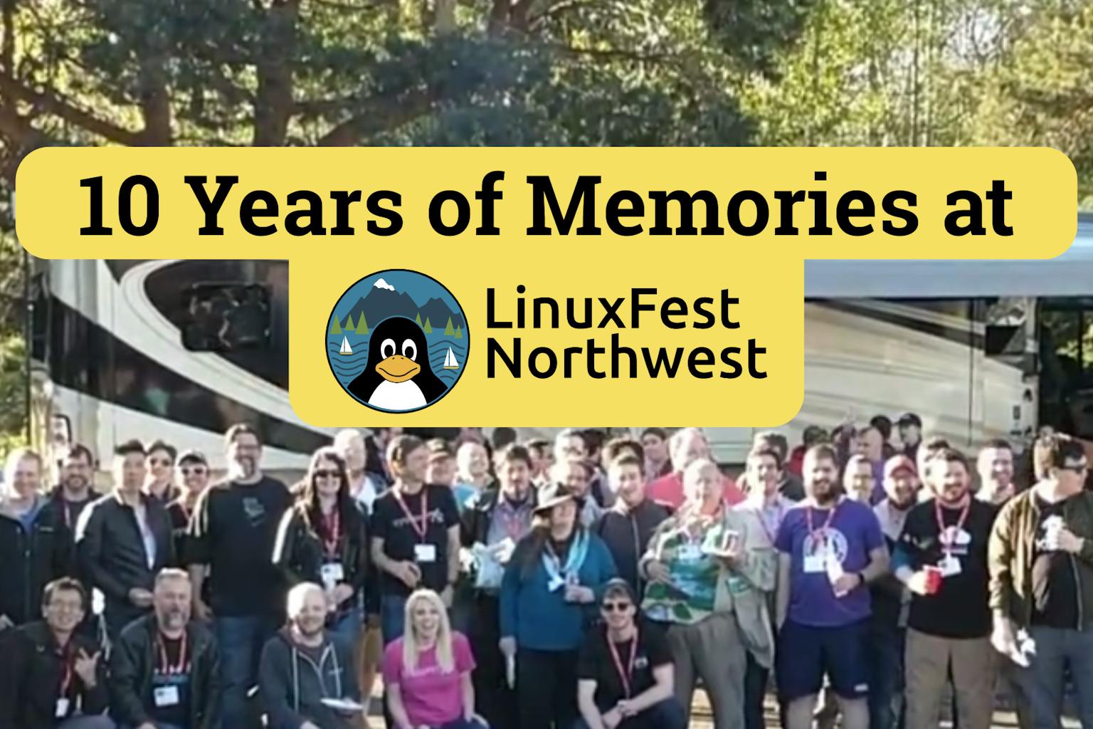 Group of LinuxFest Northwest attendees in front of Lady Jupes RV and text that reads 10 years of memories at LinuxFest Northwest