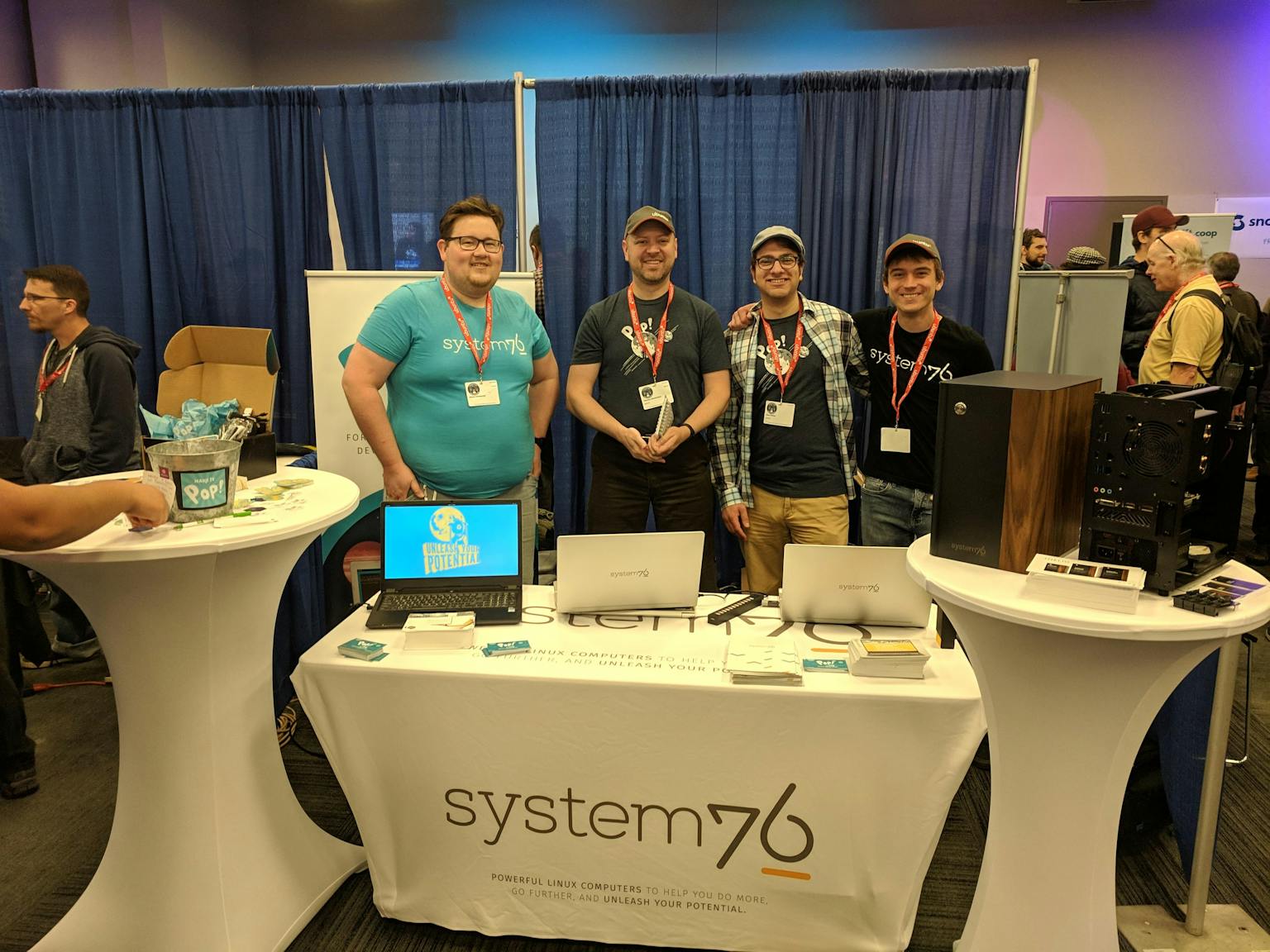 System76 Team hanging at the System76 booth in 2019. From left, Aaron, Thomas, Alex, Levi.