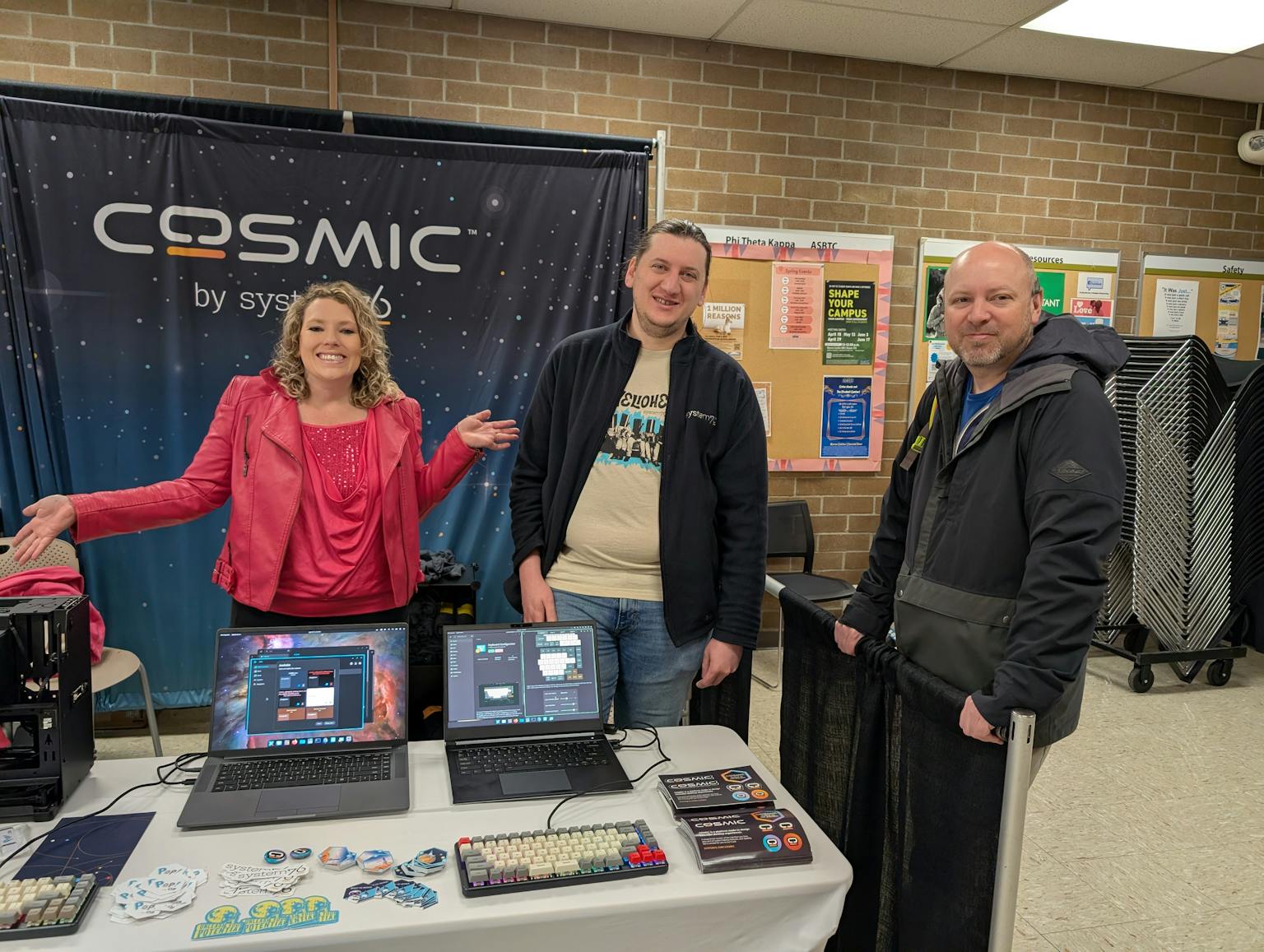 The System76 booth at LinuxFest Northwest in 2025. From left, Emma, Stetson and Thomas.