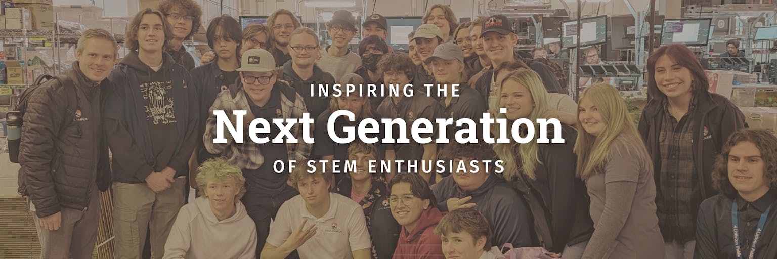 Group photo with text that reads Inspiring the next generation of stem enthusiasts