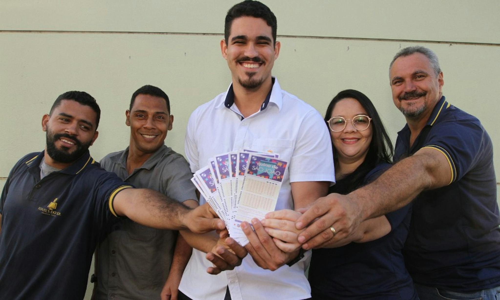 People holding lottery tickets