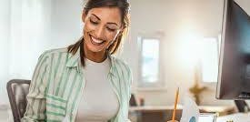 Happy woman looking at papers