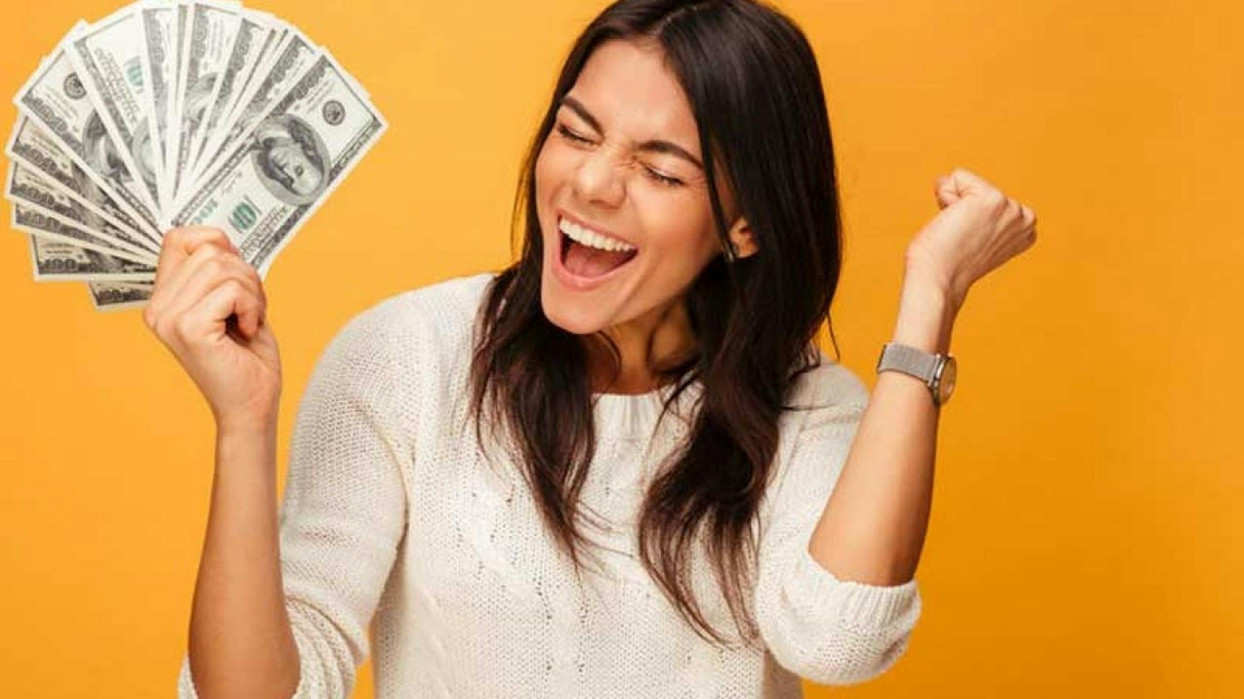 Woman holding money