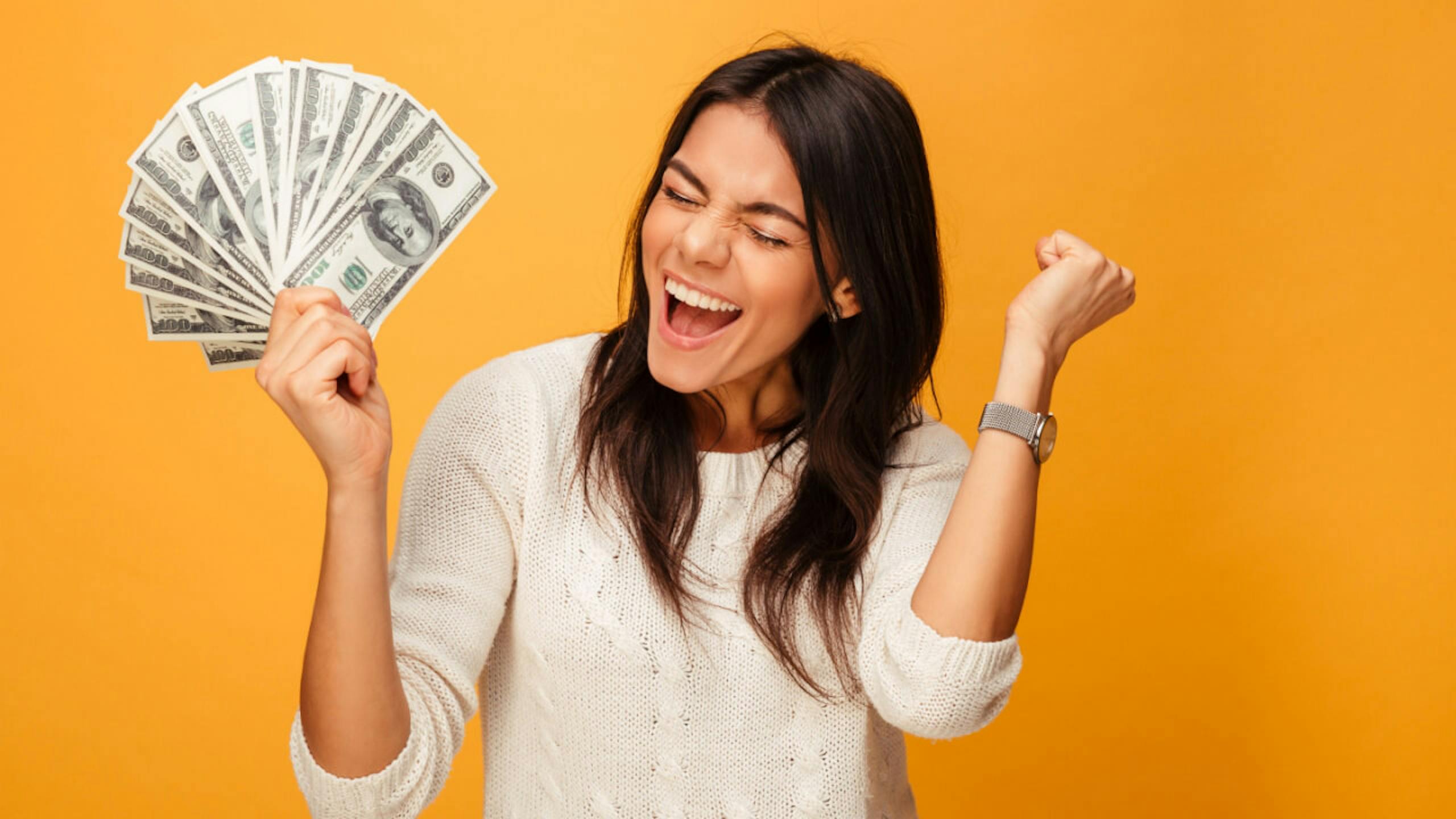 Woman Celebrating with Money