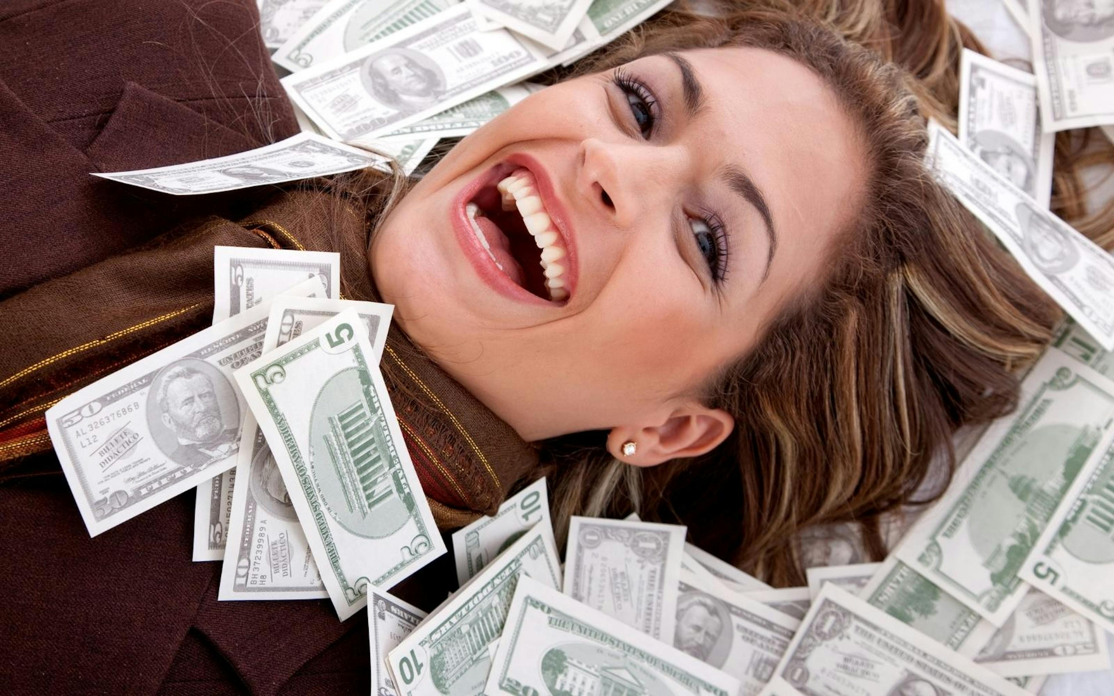 Woman smiling with Money