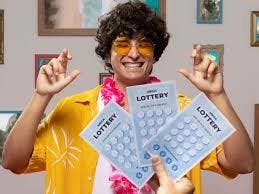 Young man cheering with lottery tickets