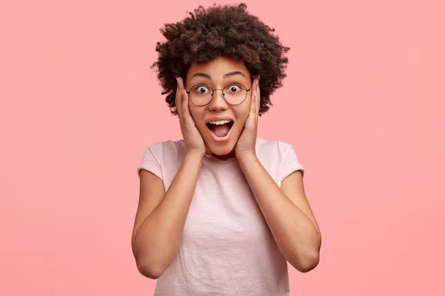 Woman with hands on face