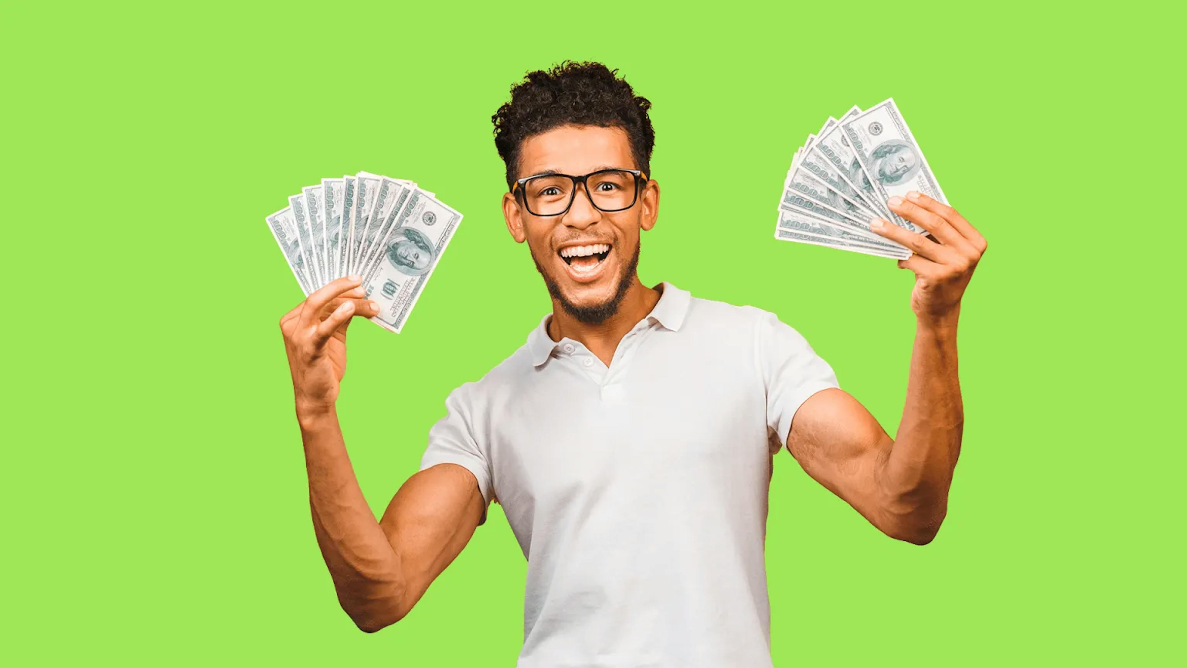 Happy man holding money