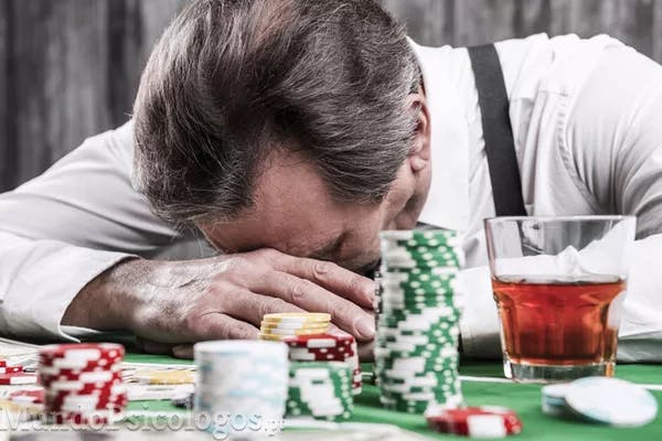 Man leaning over a gaming table