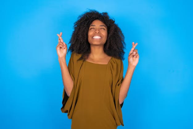 Woman with fingers crossed