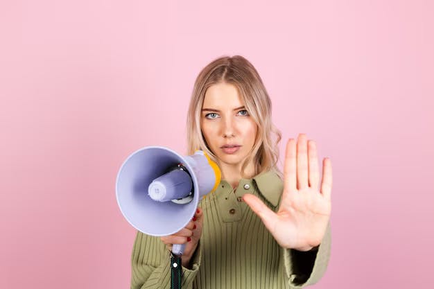 Woman with a loudspeaker and outstretched hand