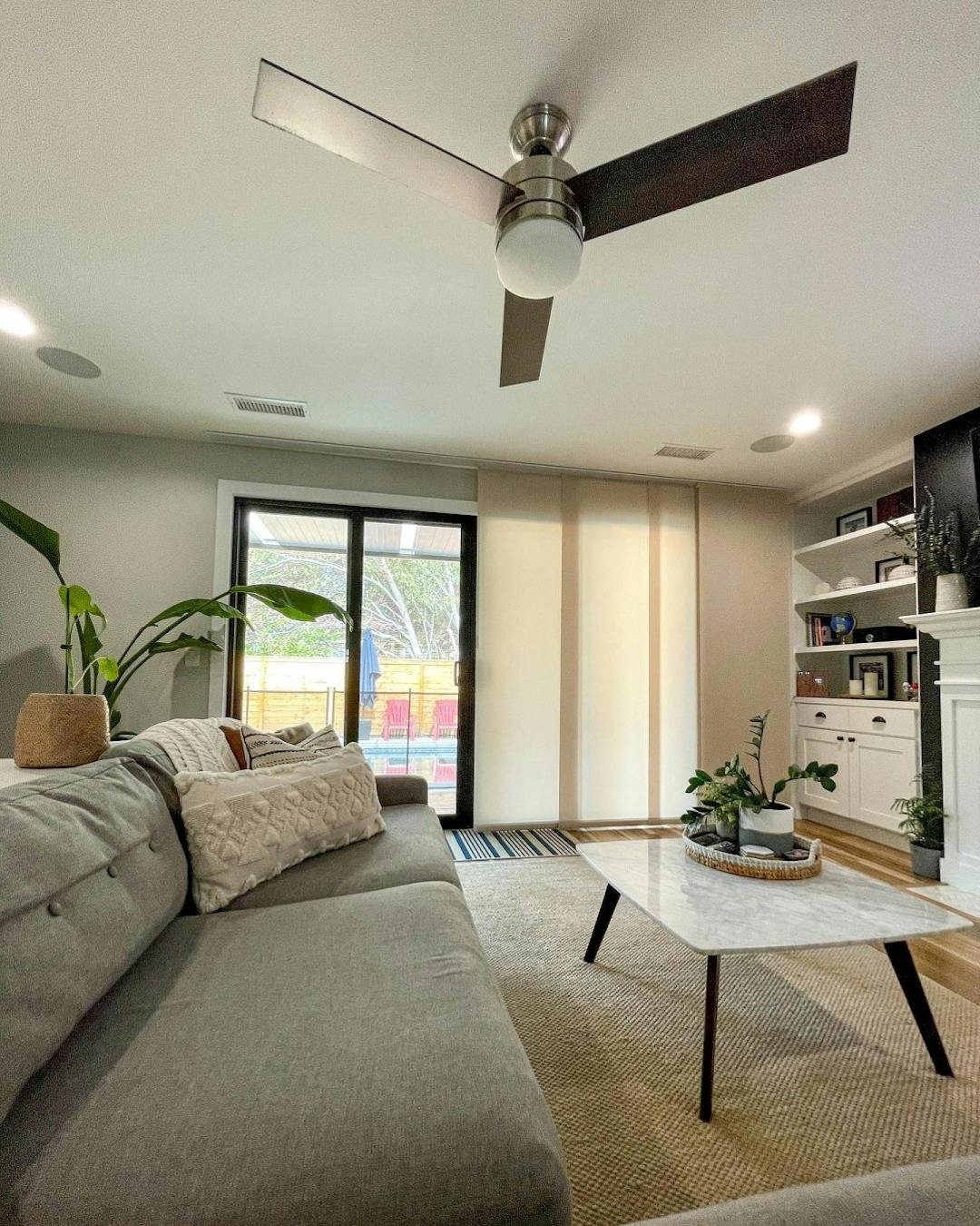 modern living room with beige fabric sliding panels