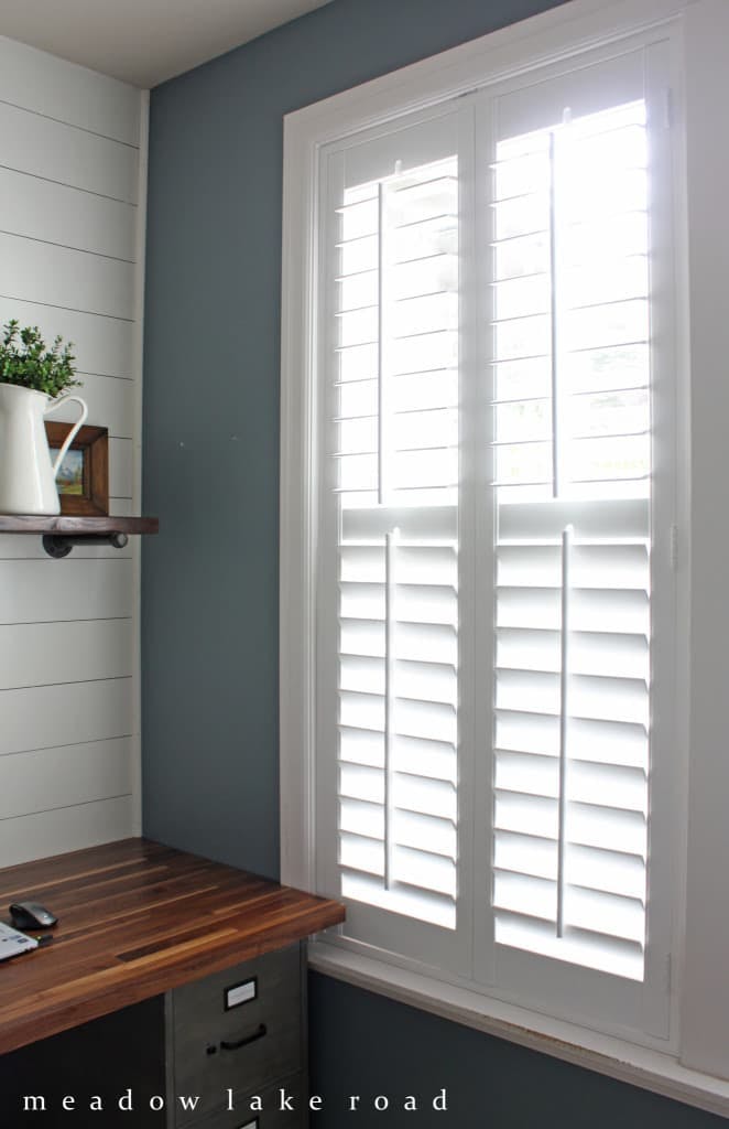 white interior shutters in a home office