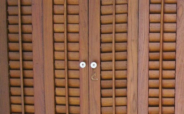 old fashioned wooden shutters with latch