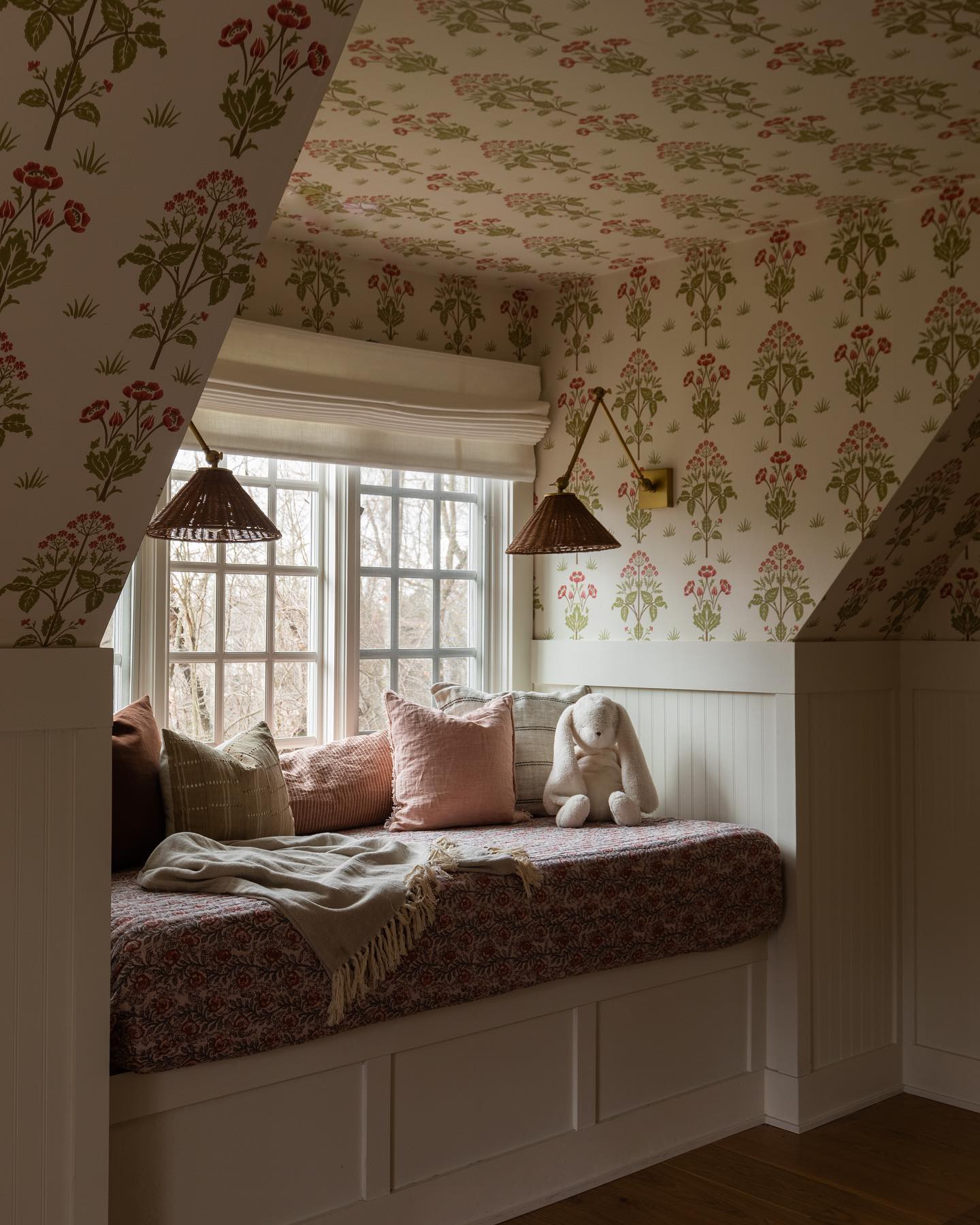 Kids bedroom with floral wallpaper and Blinds.com premium roman shades