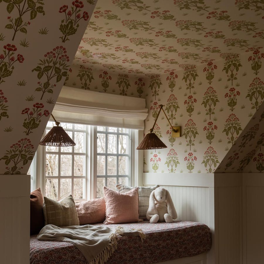Kids bedroom with floral wallpaper and Blinds.com premium roman shades