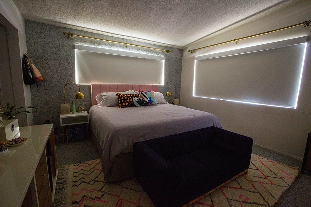 modern bedroom with blackout shades and very visible light gaps on the sides.