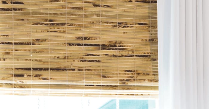 Close-up image of Blinds.com woven wood shades in the color Antigua Natural
