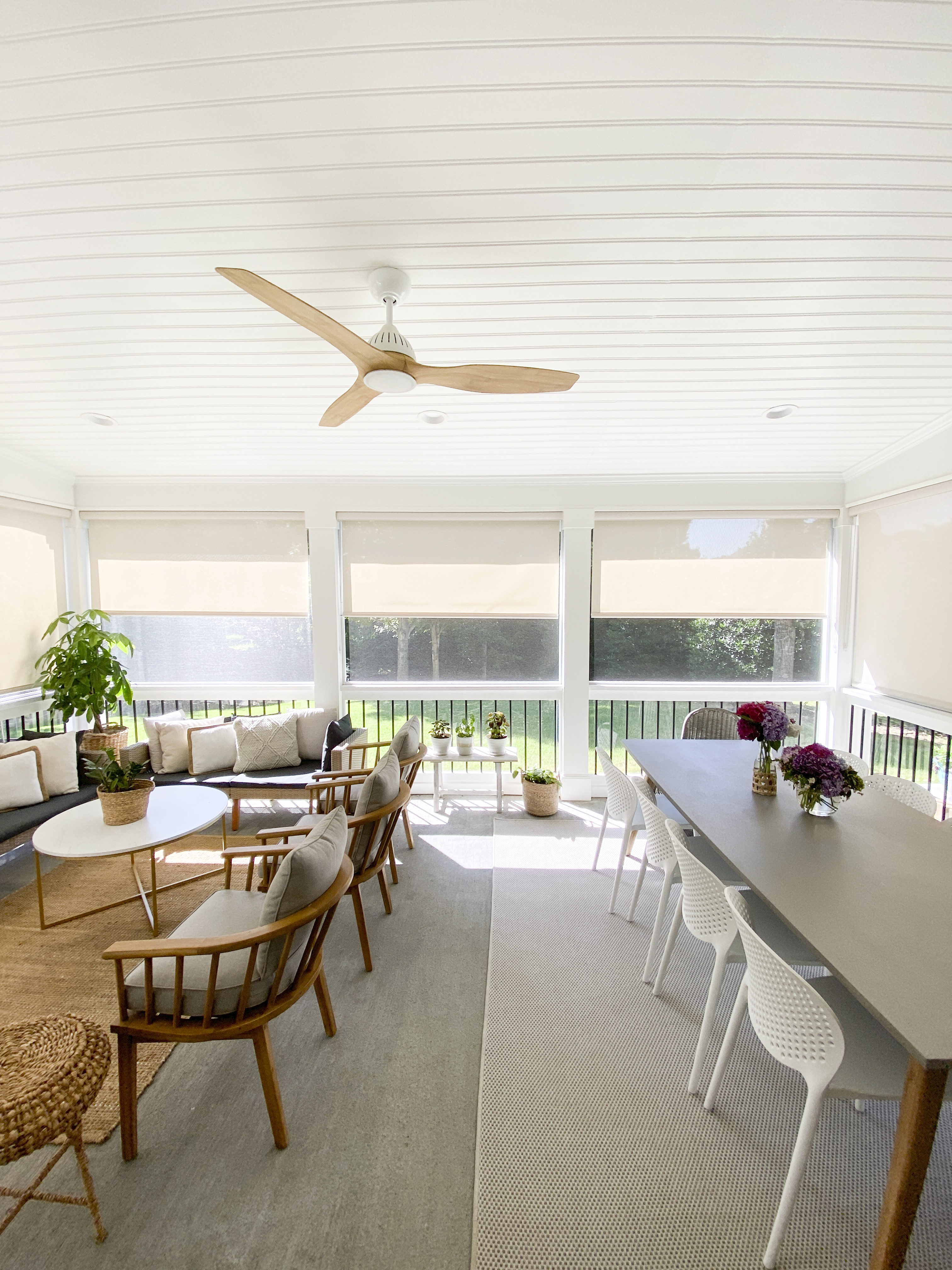 screened porch with beige outdoor solar shades