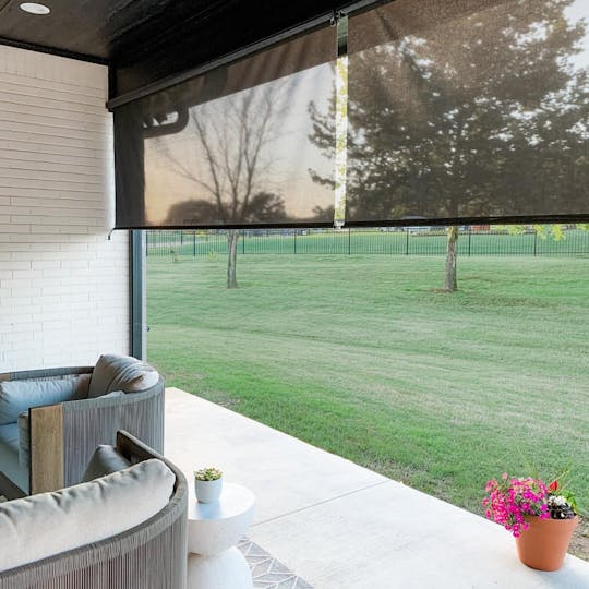 patio with heavy duty outdoor shades and patio furniture