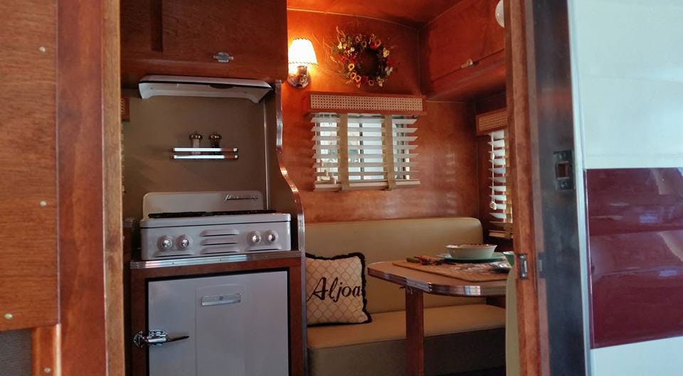 retro trailer with vintage stove and wood blinds