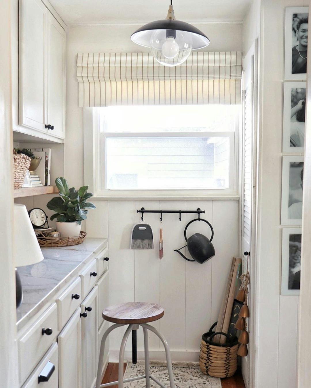 All white workshop area with Premium Roman Shades on the window.