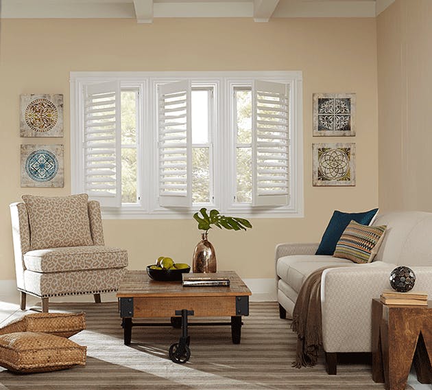 white interior shutters in a beige living room